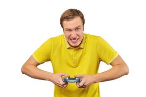 Funny handsome gamer with gamepad, excited video game player isolated on white background photo