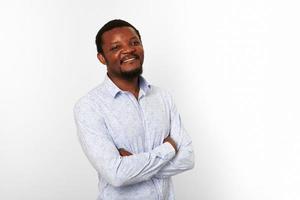 Happy african american black man with crossed arms in casual bright shirt isolated white background photo