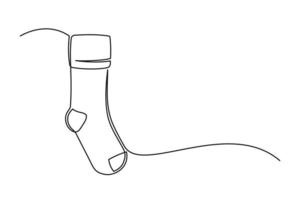 dibujo continuo de una línea de calcetín navideño vector