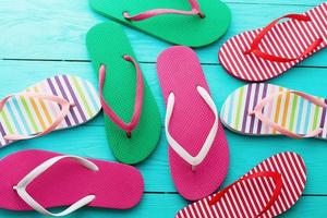 flip flops on blue wooden floor background. Top view and copy space. Summer fun weekend photo