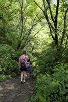 young woman descending in the ravine, vegetation and trees, huentitan ravine guadalajara, mexico photo