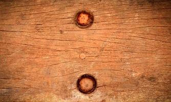 Nail in wood surface, horizontal photo