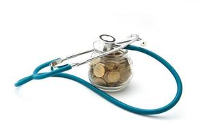 stethoscope with coins in the savings, financial concept photo