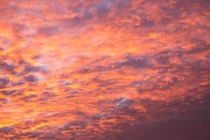 beautiful morning sky filled with crimson and orange colors , autumn sunrise background photo