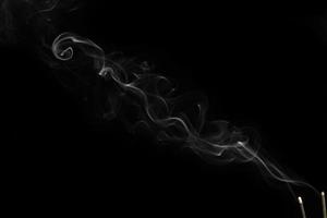 White smoke on black background for layer overlay effect. A realistic smoke or fog effect for photo and video manipulation effect and mystery design theme