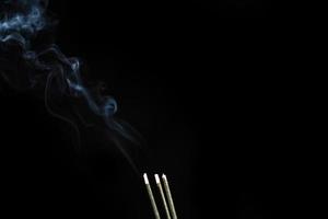 White smoke on black background for layer overlay effect. A realistic smoke or fog effect for photo and video manipulation effect and mystery design theme