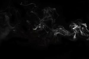 White smoke on black background for layer overlay effect. A realistic smoke or fog effect for photo and video manipulation effect and mystery design theme