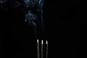 White smoke on black background for layer overlay effect. A realistic smoke or fog effect for photo and video manipulation effect and mystery design theme