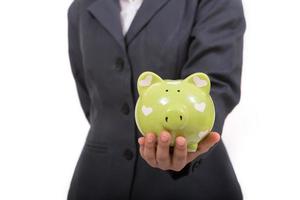 Beautiful asian woman holding piggy bank photo