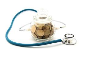 stethoscope with coins in the savings, financial concept photo