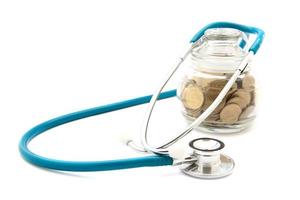 stethoscope with coins in the savings, financial concept photo