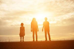 kid silhouette,Moments of the child's joy. On the Nature sunset photo