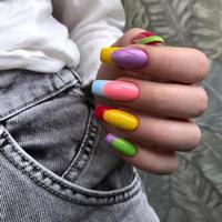 Bright multi-colored design of manicure.Multicolored manicure close up photo