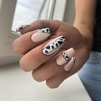 Female manicure with leopard design photo