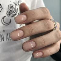 Stylish trendy female natural manicure.Hands of a woman with natural manicure on nails photo