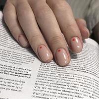 Women's pink manicure with design.Hands of a woman with pink manicure on nails photo