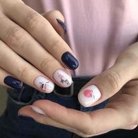 Stylish trendy female blue manicure with design.Hands of a woman with blue manicure on nails photo