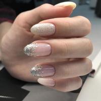 Stylish trendy female manicure with design.Women's manicure with glitter.Woman's hands with glitter on nails photo