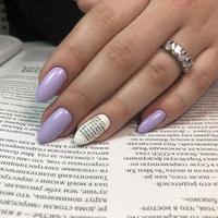 Stylish trendy female purple manicure with design.Hands of a woman with purple manicure on nails photo