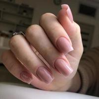 Stylish trendy female pink manicure.Hands of a woman with pink manicure on nails photo