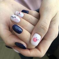 Stylish trendy female blue manicure with design.Hands of a woman with blue manicure on nails photo