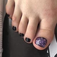 Purple pedicure. Purple pedicure on female feet photo