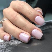 Stylish trendy female pink manicure.Hands of a woman with pink manicure on nails photo