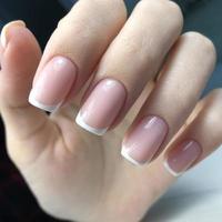 French manicure on the nails. French manicure design. Manicure gel nail polish photo