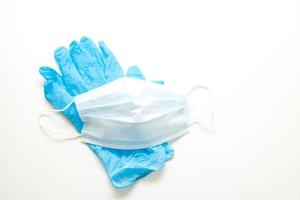 medical gloves and mask on a white background photo