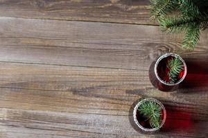 Cranberry red drink decorated with fir tree branches berry and sugar. Christmas hot mulled wine photo