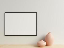 Clean and minimalist front view horizontal black photo or poster frame mockup hanging on the wall with vase. 3d rendering.