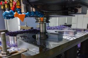 A process of cnc milling of lagre thick steel palte by curved trajectory, Selective focus with blur technique. photo