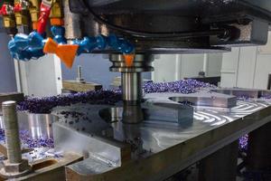 A process of cnc milling of lagre thick steel palte by curved trajectory, Selective focus with blur technique. photo