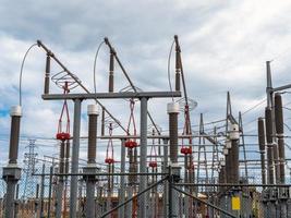 a view of an electric power station under grey cloudy sky photo