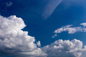 Regular spring clouds on blue sky at daylight in continental europe. Close shot wit telephoto lens and polarizing filter. photo