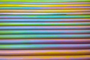 An abstract lines backround of colorful cadmium coated steel bars. photo