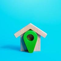 House and green location pin. Ecological housing, green technologies in building. Concept of finding a home to buy or rent. House moving company. Delivery place. photo