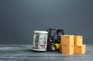 Forklift with money dollar roll and boxes. Profit from selling goods, trade income. Transport business. Economic zone. Import export. Logistics. Taxes, budgetary donor support. Transportation cost photo