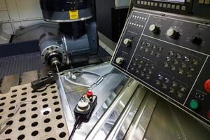 measuring process with ruby touch probe on large CNC milling machine in jog mode photo