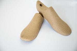 Two cardboard shoe lasts with white background photo