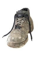 worn-out old work boot, isolated on white background with shadow photo