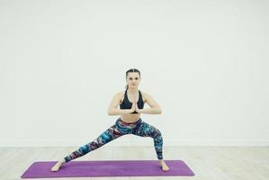 sporty woman relaxes in gym photo