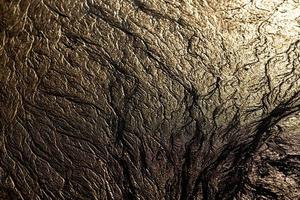 abstract mud background with water washout trails and selective focus photo