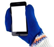 cellphone with white-blue mittens isolated on white background photo