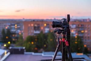 pro dslr on tripod in evening roof photoshoot photo