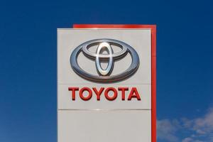 Toyota logo on promotional stand at sunny day - Toyota Motor Corporation is a Japanese automotive manufacturer. photo
