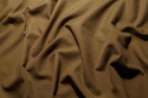 crumpled khaki tan crumpled tan khaki canvas fabric - full frame background and texture photo