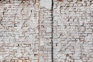 old brick wall with white plaster - full frame background and texture photo