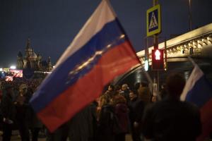 Moscow, Russia. 09 30 2022 Flag of Russia at government rally. Rally in support of authorities in Russian Federation. photo