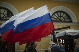 Moscow, Russia. 09 30 2022 People in Moscow with Russian flags. photo